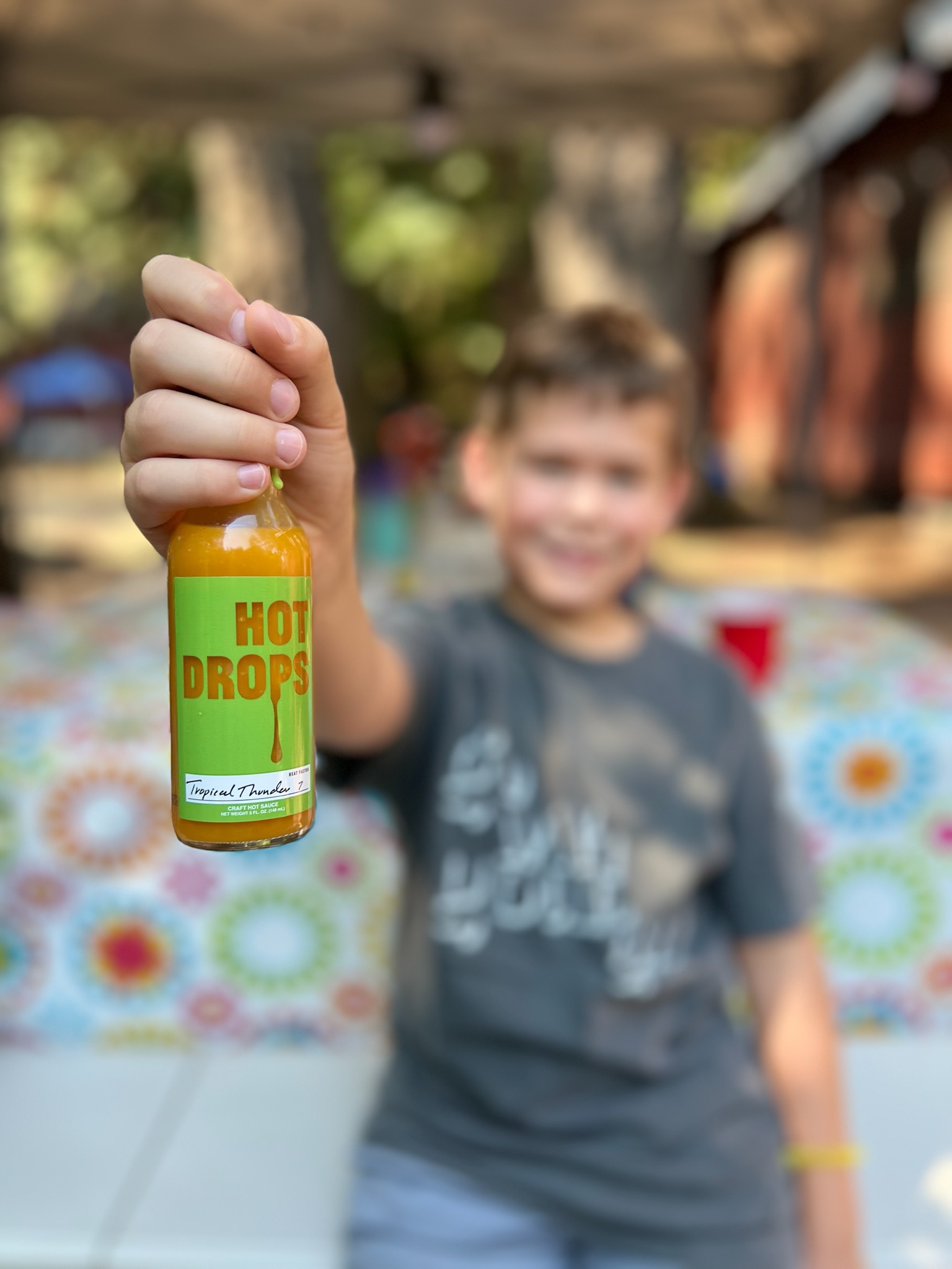 Tropical Thunder bottle held up at a summer gathering