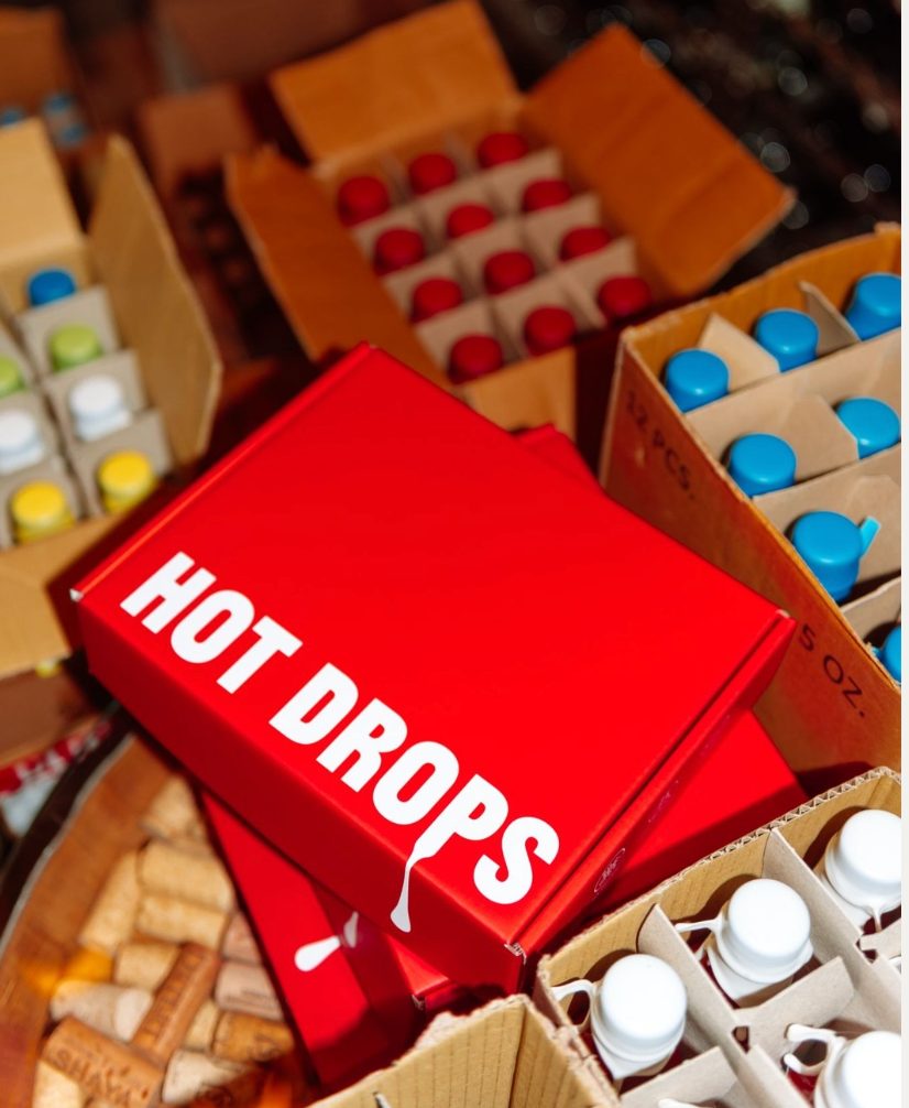 Hot Drops mailer boxes on the floor of the packing room