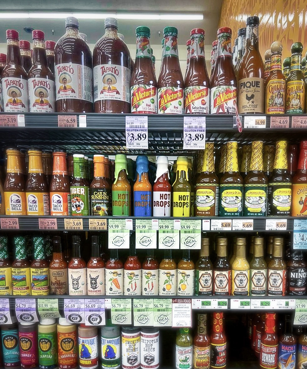 Hot Drops bottles on a grocery store shelf