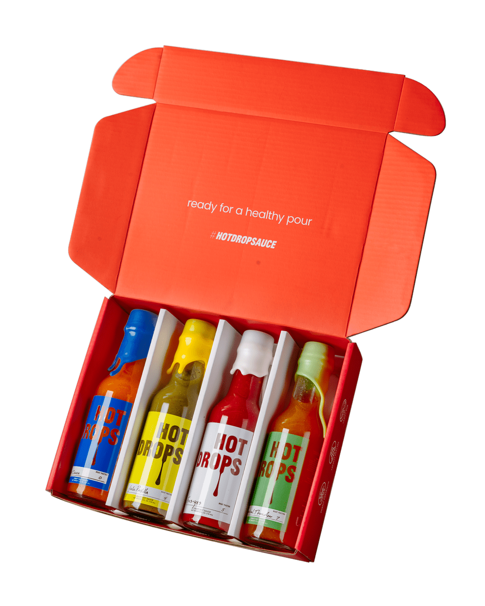 Hot Drops variety pack, four bottles in an open mailer box