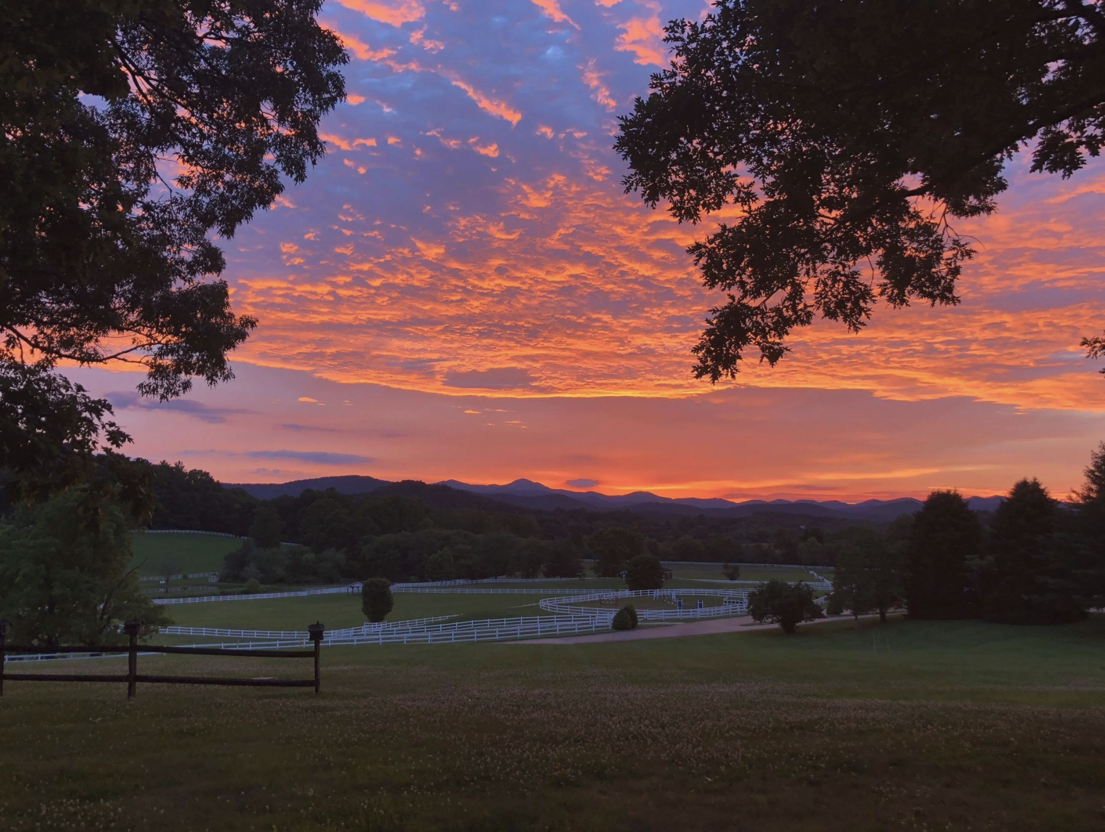 Sunset over the paddocks and mountains