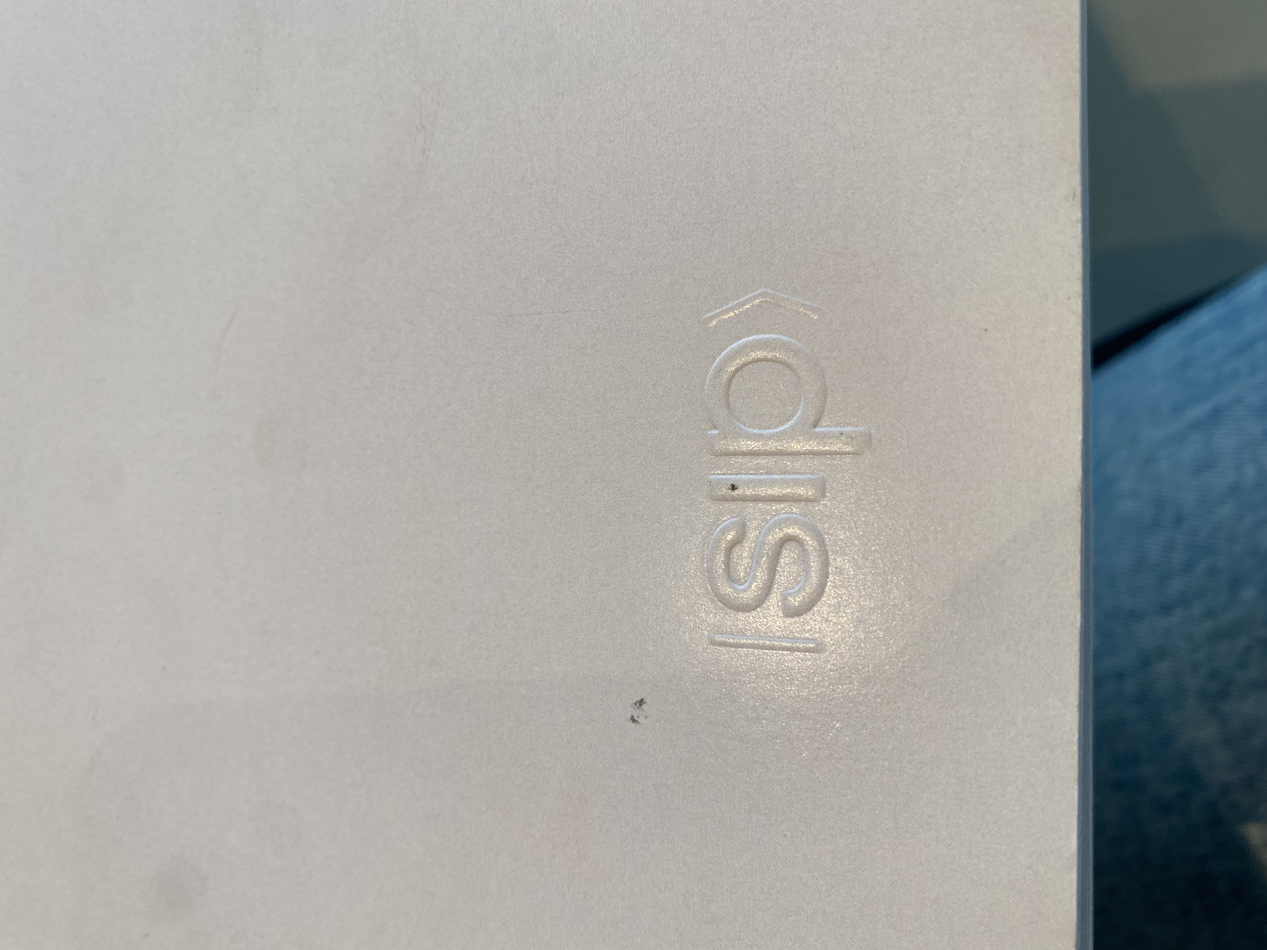 Close-up of the blind-embossed SIP mark