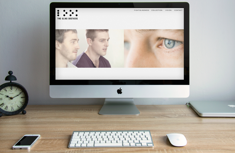 Two Blind Brothers website on an iMac