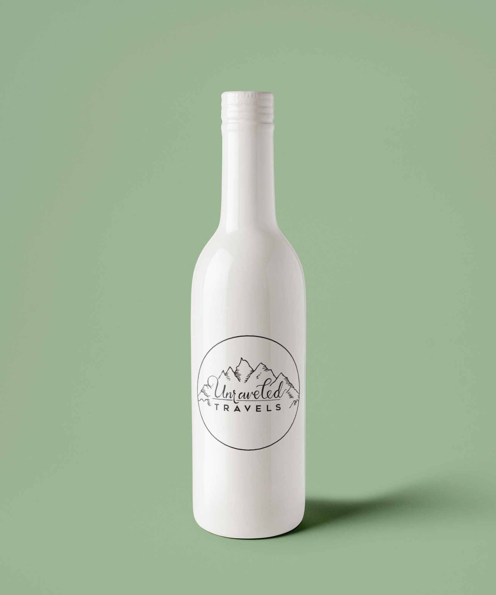 Unraveled Travels logo on a white ceramic bottle