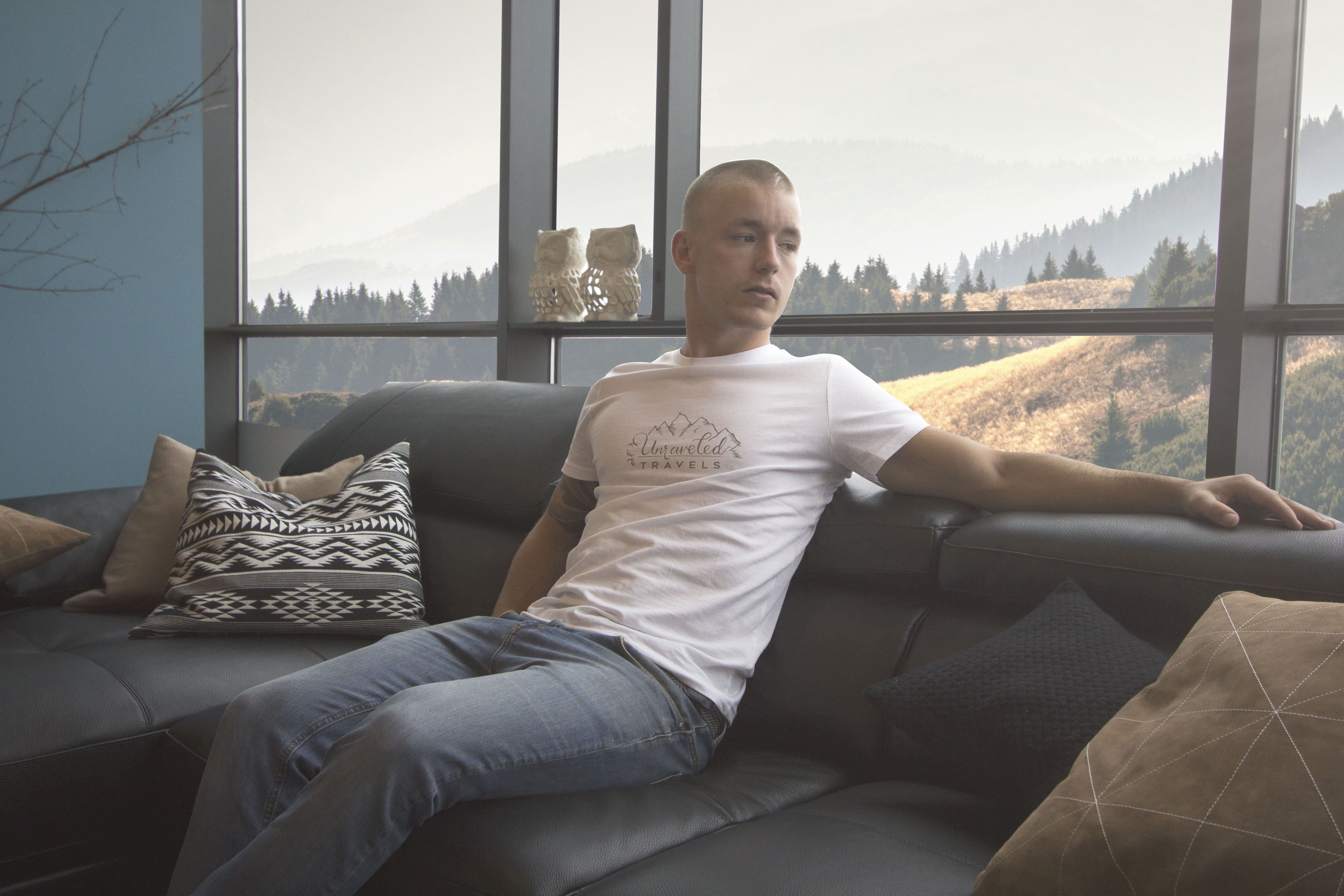 Unraveled Travels logo on a white t-shirt